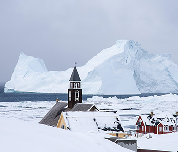 Ilulissat-Zion-Church-in-front-of-a-massive-iceberg-city-tour-Guide-to-Greenland